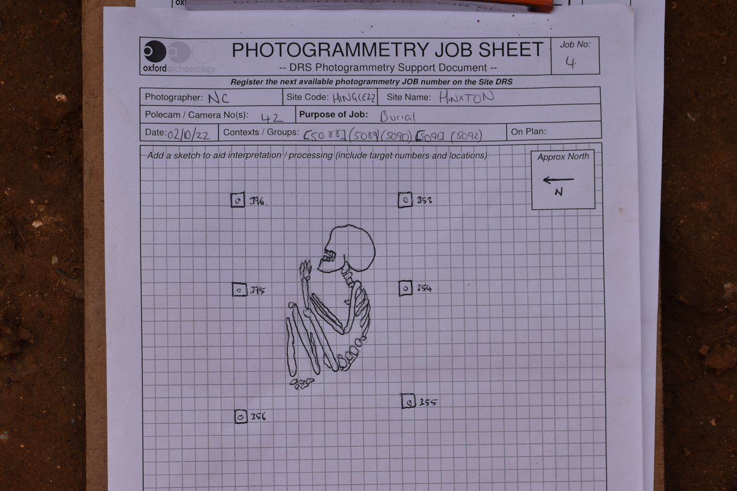 A sketch of a crouched burial on a photogrammetry recording sheet.