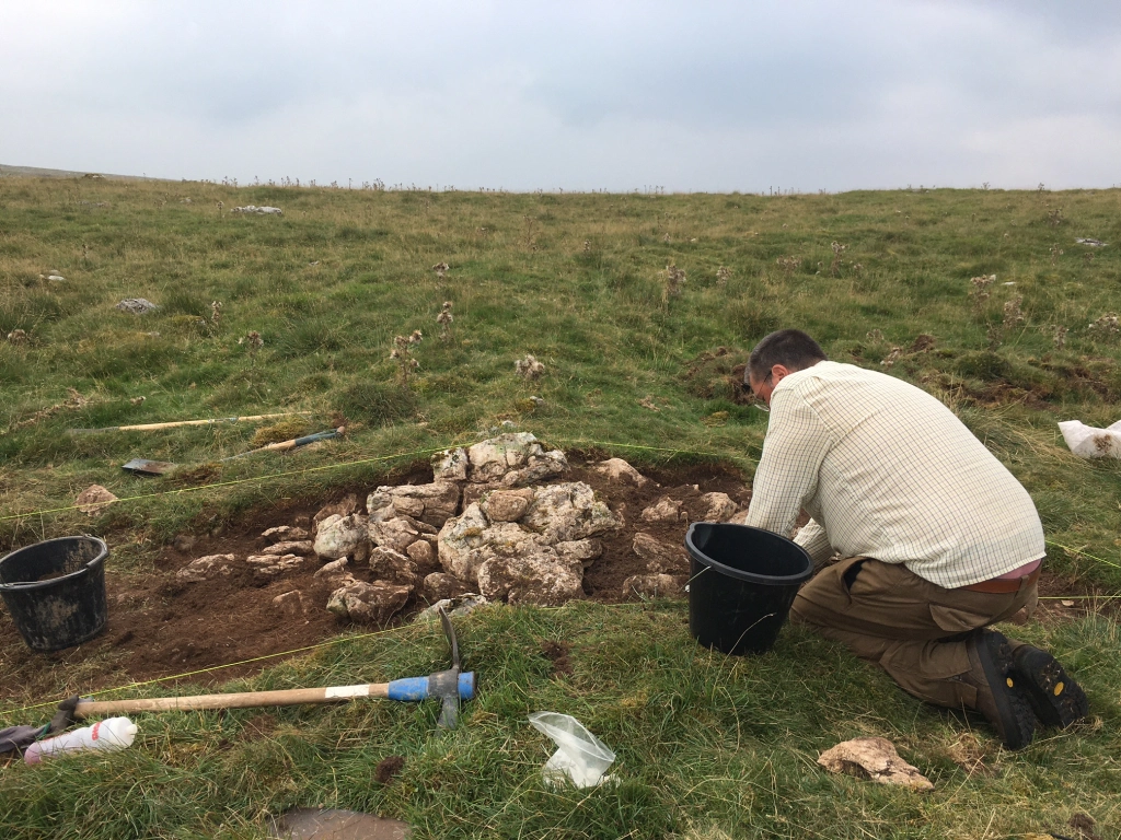 Cleaning Trench 6 across the boundary of the stock enclosure