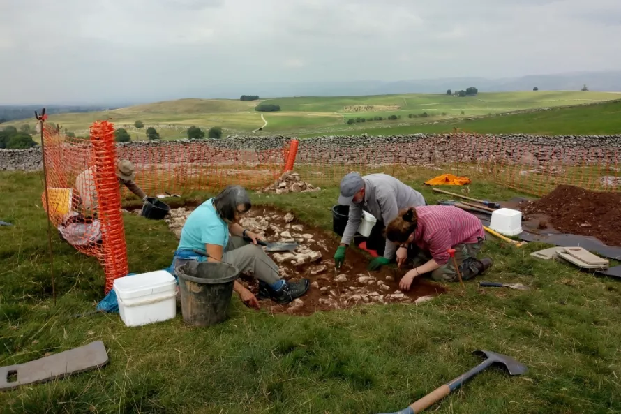 Excavating and cleaning the upper surface of the wall/bank
