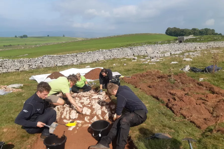 The Apprenticeship team excavating the new trench in the enclosure