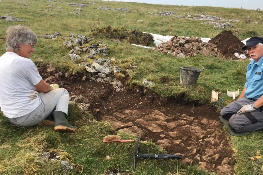 Jan and Bob excavation the trench (Trench 5) through the round house