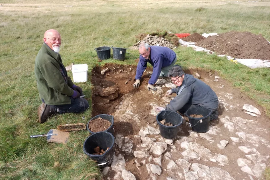 Perry, Richard and Linda dig down into the body of the clearance cairn