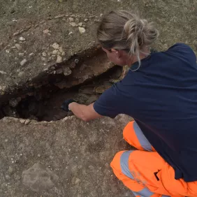 Archaeologist digging a kiln