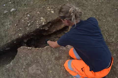 Archaeologist digging a kiln