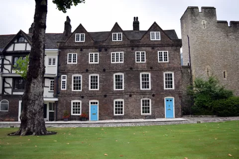 Image of 4-5 Tower Green with lawn in the foreground and part of one of the towers from the Tower of London on the right