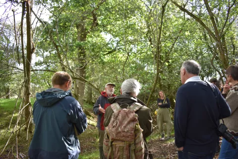 Jeremy Hodgkinson (Wealden Iron Research Group) leading a discussion about the interweaving of seventeenth century iron working, farming and woodland management at Knepp on an Archaeology in Wilding safari.
