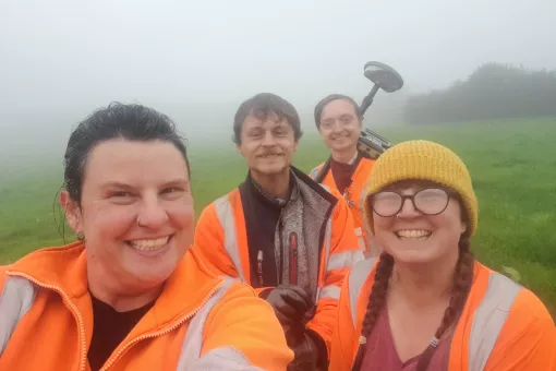 Becky and 3 more colleagues in a very misty, damp field