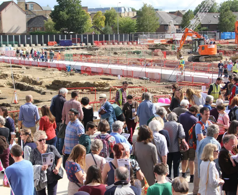 A crowd of people wait for tours of the Westgate excavation in Oxford