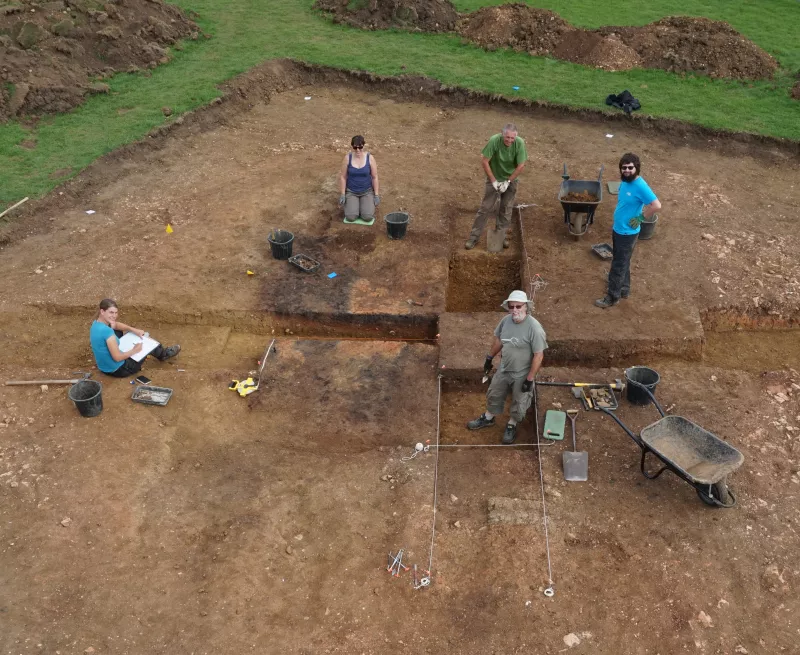 Overview photo of volunteers excavating the site of Ramsey Abbey