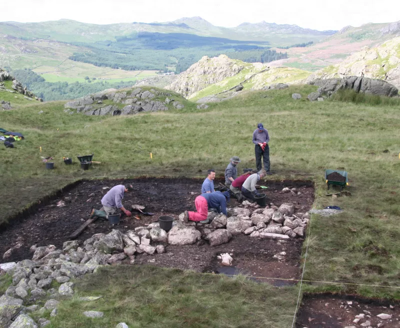 OA team excavating a ring cairn near SeathwaiteTarn, Lake District