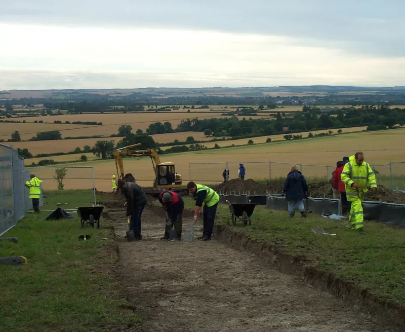 Volunteers and archaeologists working together in one of the trenches
