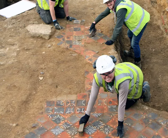 Medieval tiled floor from the Greyfriars cloister pavement exposed before lifting for conservation work