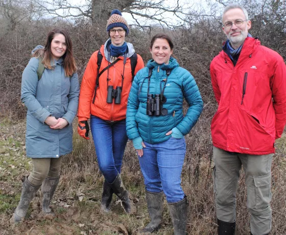 Group of people in the outdoors. ‘Rewilding’ project lead, Anwen Cooper, with colleagues from Historic England and ecologists from Knepp Castle Estate