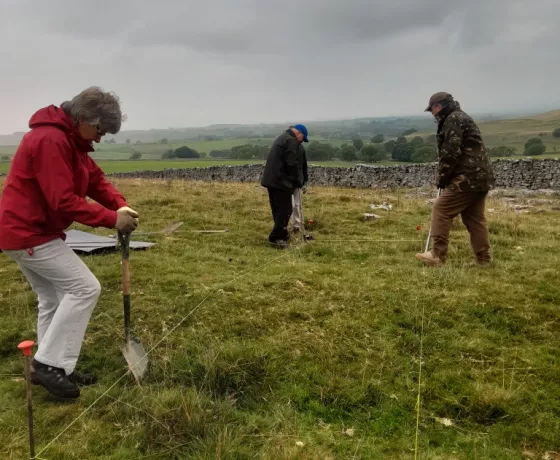 Volunteers starting to deturf a site.