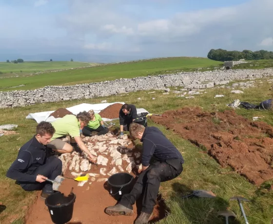 The Apprenticeship team excavating the new trench in the enclosure