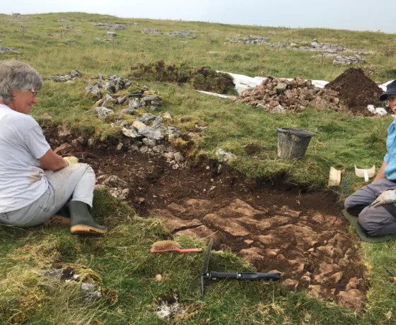 Jan and Bob excavation the trench (Trench 5) through the round house