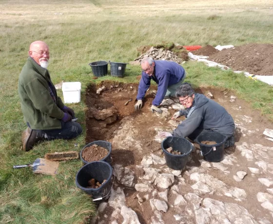 Perry, Richard and Linda dig down into the body of the clearance cairn