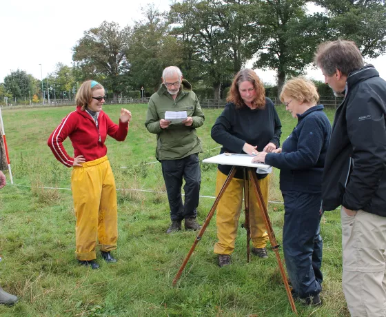 Volunteers learning how to survey