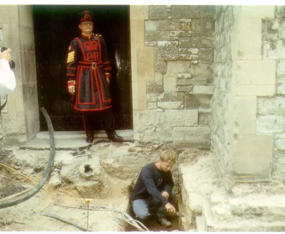 Richard Brown at work under the supervision of a Beefeater.