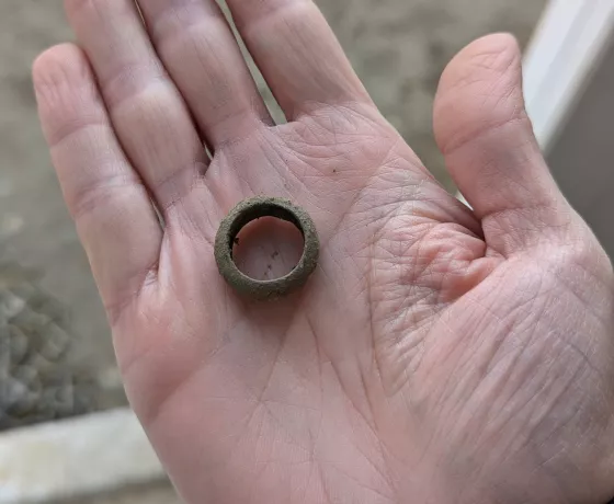 Metal ring held in the palm.